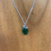 Jade oval pendant with a twist