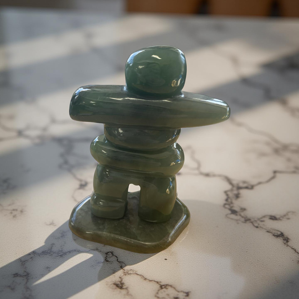 Jade Inukshuk on a base