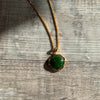 Jade Circle set in gold rectangle