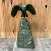 Jade Eagle landing on mountain top